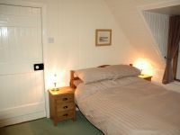 The bedrooms have pine-lined walls and ceilings and are cosy and welcoming. There are superb views from the bedroom windows.